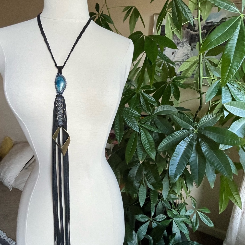 Handmade necklace w precious stone wrapped in beads